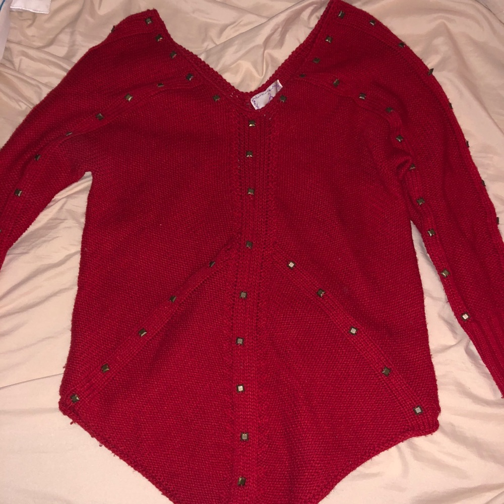 Red sweater with gold studs